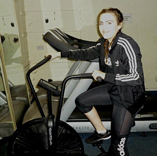 Nia Smith cycling in the gym